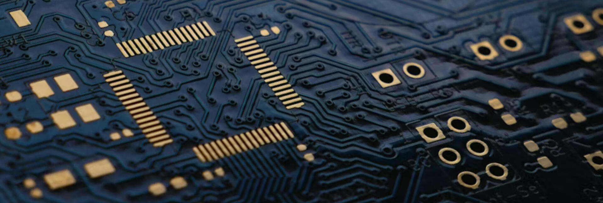 A black circuit board with shiny copper details.